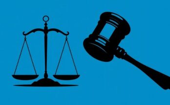 A silhouette of a gavel and scales against a dramatic blue background, representing justice and decision-making in politics.
